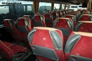 Przewozy Pasażerskie MASZ BUS - przewóz osób oraz wynajem autobusów, autokarów i busów - FOTELE WYPOSAŻONE W PODNÓŻKI, SIATECZKI I STOLIKI